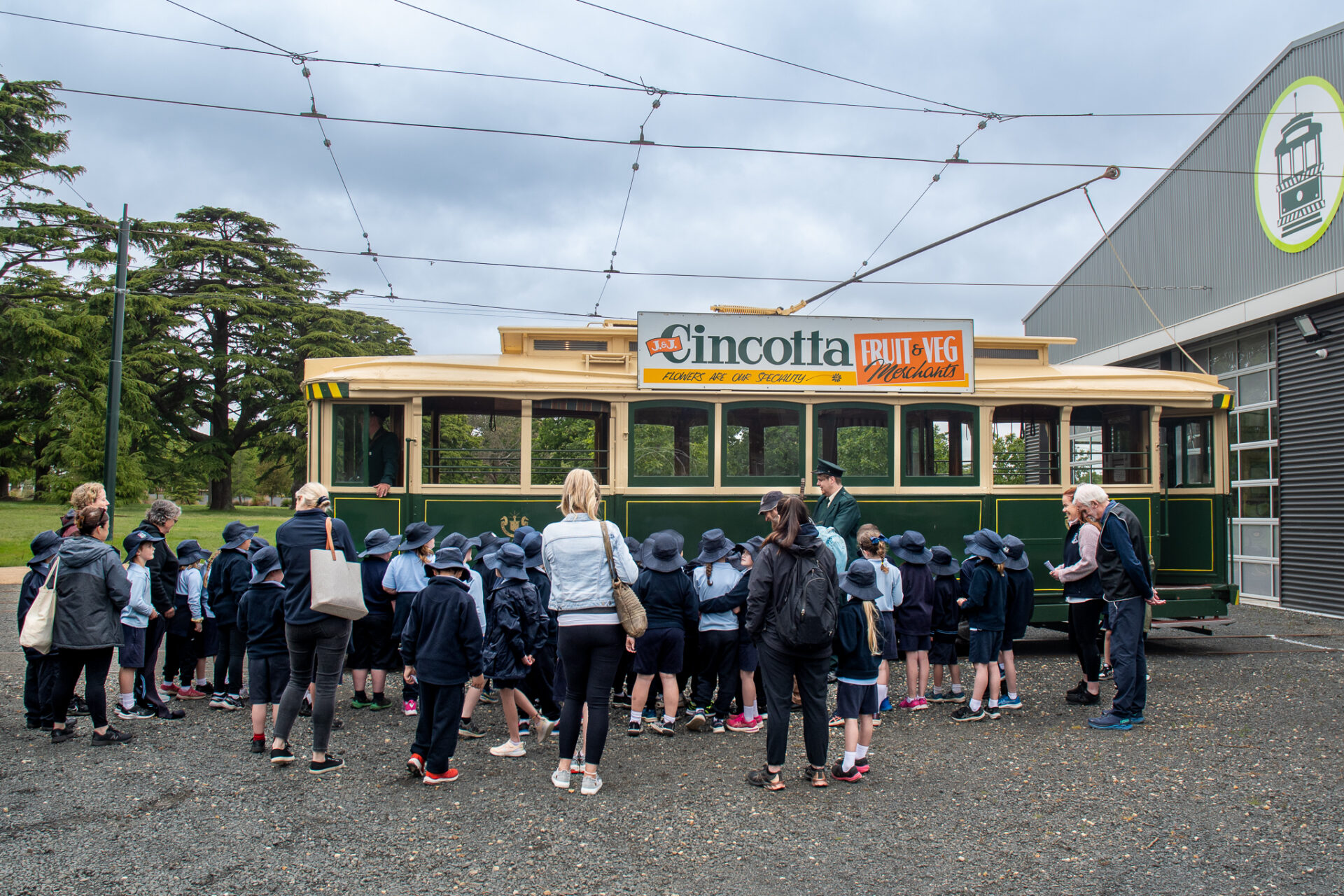 Students about to board a vintage tram