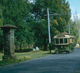 A tram bound for the Gardens passes the gate pillars at the St Aidans Drive end. April 1958.
