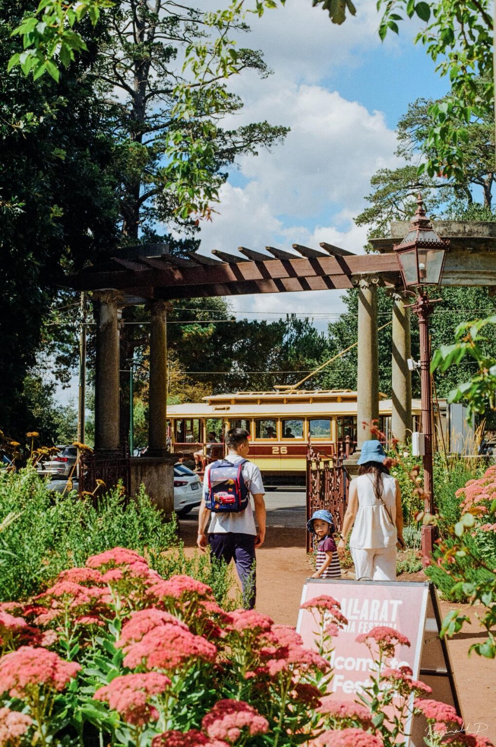 Photo through the McDonald gates with tram 26 behind.