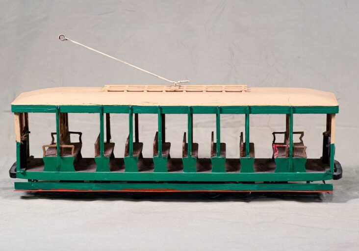 An open tram, known as a summer car.