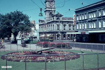 Floral Clock - 23-2-1963 with Town Hall and Myer store in the Background. Tram No. 38 heads west in Sturt St. Photograph Wal Jack.