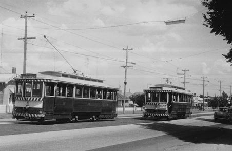 Trams 30 and 33 cross at the Bell St loop in Skipton St - a signal can be seen on the pole between the trams.